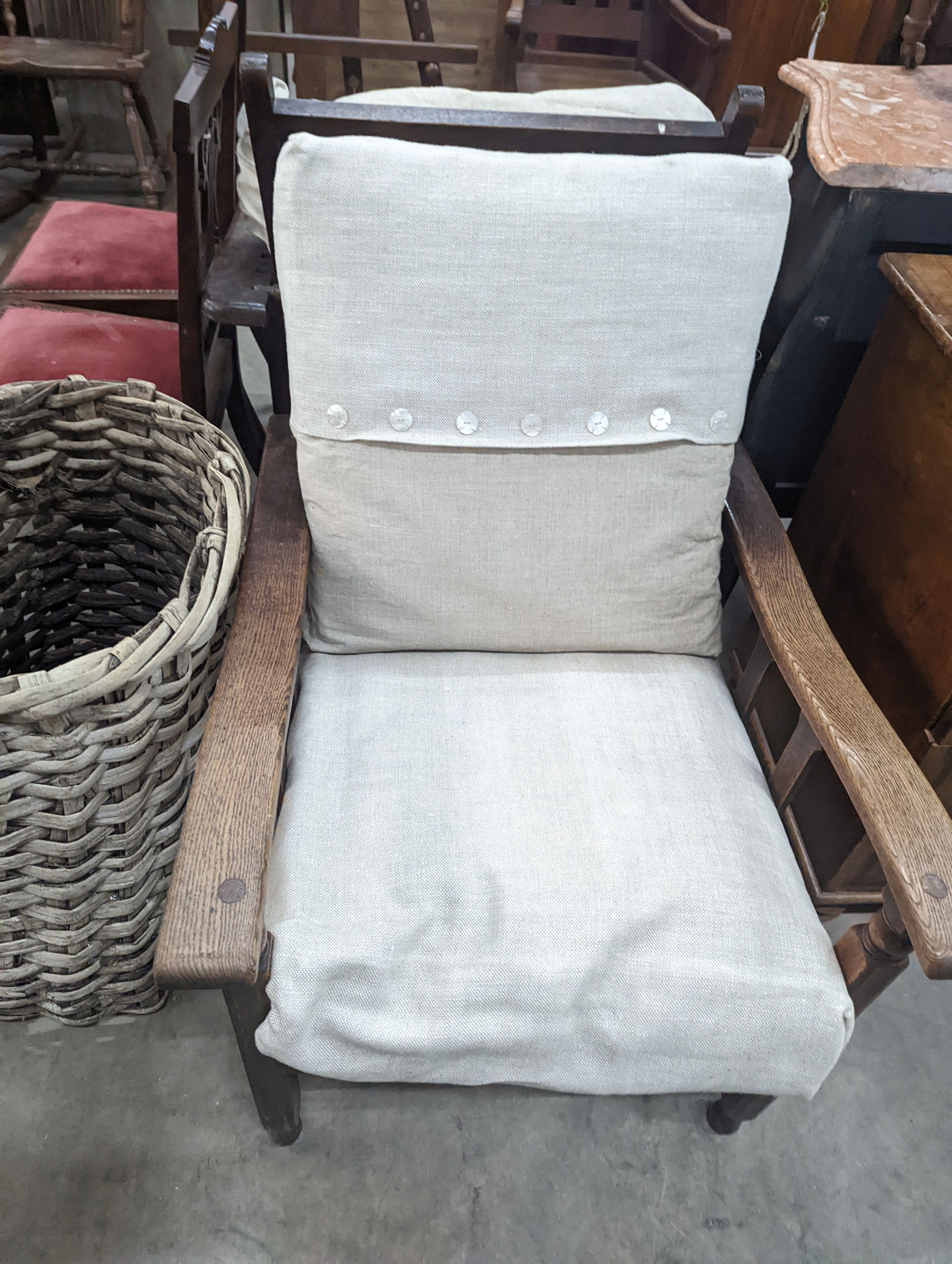 Two early 20th century oak reclining armchairs, larger width 73cm, depth 86cm, height 93cm